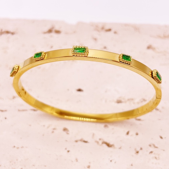 Elegant Gold Bangle with Green Accents